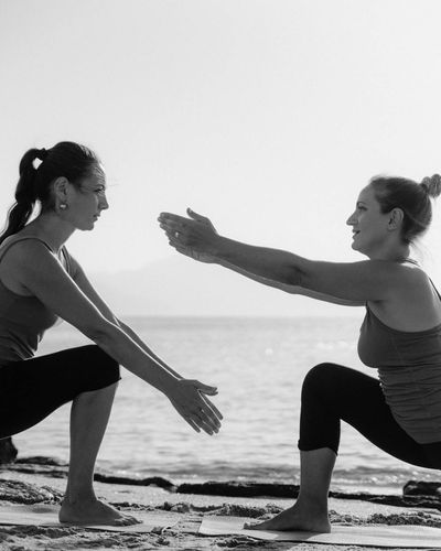 Person doing morning stretching exercise at sunrise